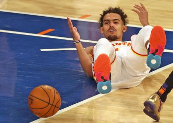 NEW YORK, NEW YORK - MAY 26: Trae Young #11 of the Atlanta Hawks reacts after he is knocked down in the first quarter against the New York Knicks during game two of the Eastern Conference Quarterfinals at Madison Square Garden on May 26, 2021 in New York City.NOTE TO USER: User expressly acknowledges and agrees that, by downloading and or using this photograph, User is consenting to the terms and conditions of the Getty Images License Agreement. (Photo by Elsa/Getty Images)
