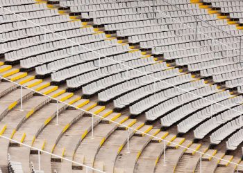 Rows of seats at empty tribunes