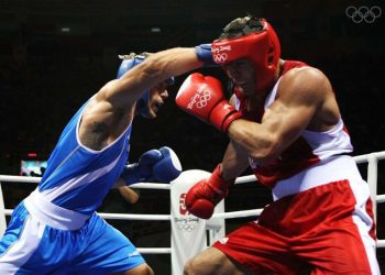 BEIJING - AUGUST 23: Rakhim Chakhkiev of Russia (red) competes against Clemente Russo of Italy (blue) in the Men's Heavy (91kg) Final Bout held at Workers' Indoor Arena on Day 15 of the Beijing 2008 Olympic Games on August 23, 2008 in Beijing, China. (Photo by Nick Laham/Getty Images)