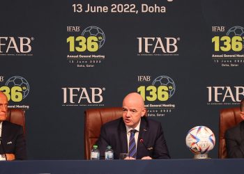 FIFA president Gianni Infantino (C), FIFA referees committee chairman Pierluigi Collina (L), and Irish Foootball Association CEO Patrick Nelson (R) attend the 137th International Football Association Board (IFAB) meeting in the Qatari capital Doha on June 13, 2022. - Football's rules body today said that five substitutes would be permanently introduced for all top games and that an automatic offside detector is closer to being introduced for this year's World Cup. (Photo by KARIM JAAFAR / AFP) (Photo by KARIM JAAFAR/AFP via Getty Images)