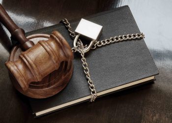 Information security concept, gavel, book with chain and padlock